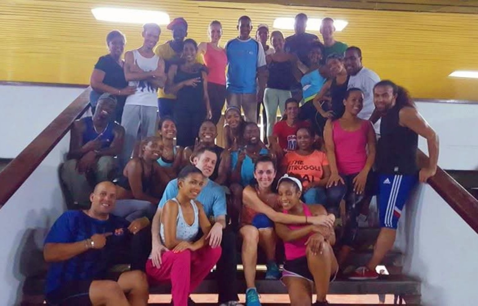 DC Casineros and All Stars dancers gathered on a staircase at Universidad de Oriente in Santiago de Cuba