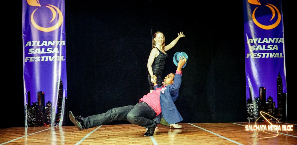 Amanda Gill and Adrian Valdivia performing together onstage at Atlanta Salsa Festival