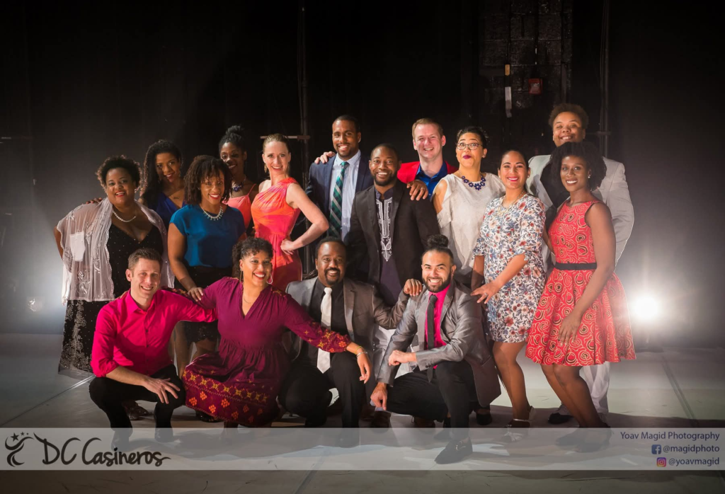 Large DC Casineros company group posing together on a theater stage