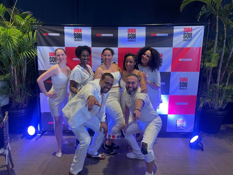 DC Casineros group wearing white in front of a CubaSon Congress backdrop