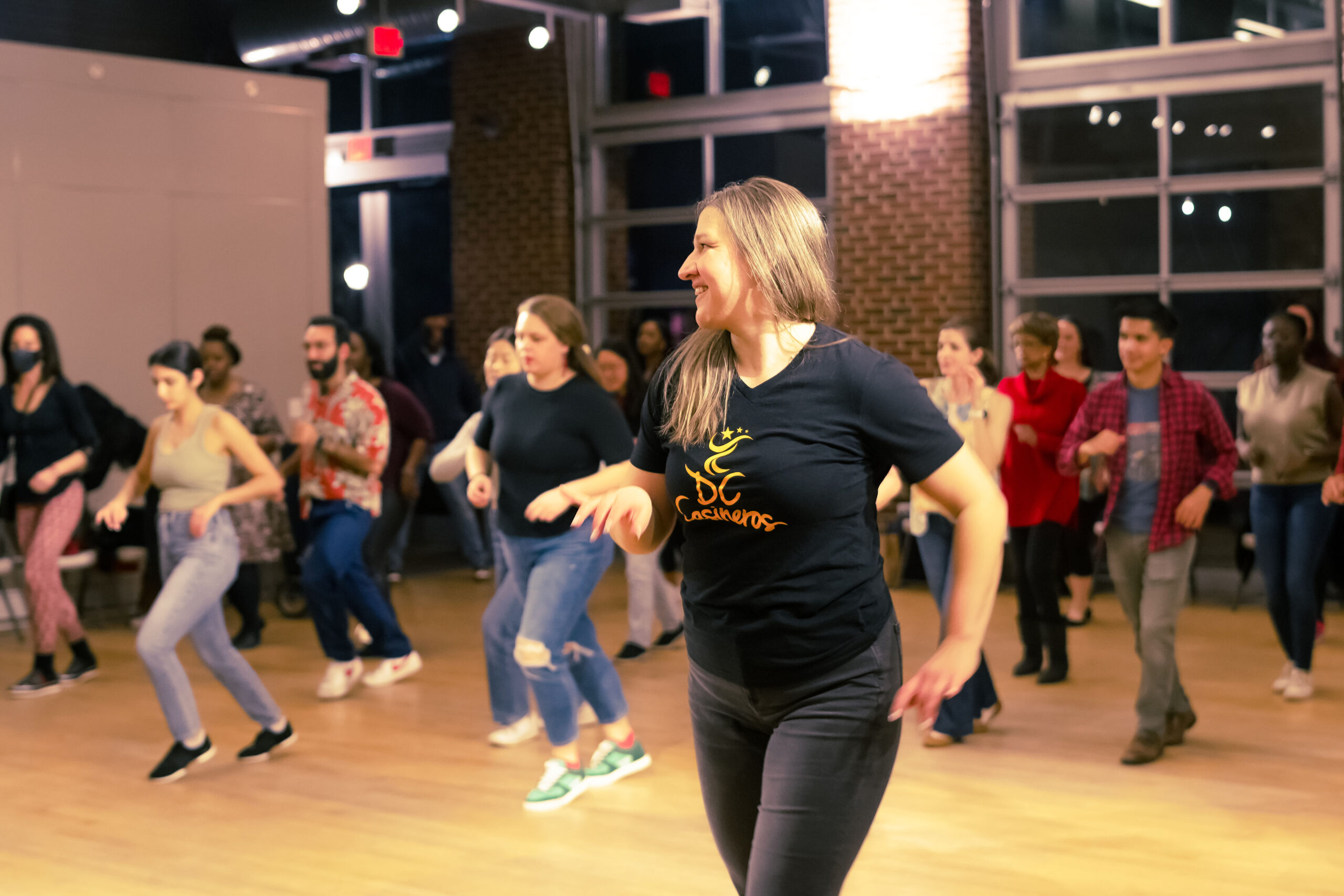 Participants dancing together at a DC Casineros Cuban Social