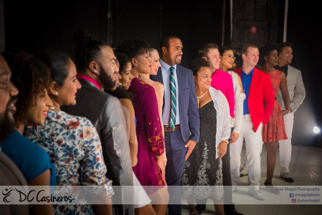 DC Casineros performers standing together at a curtain call