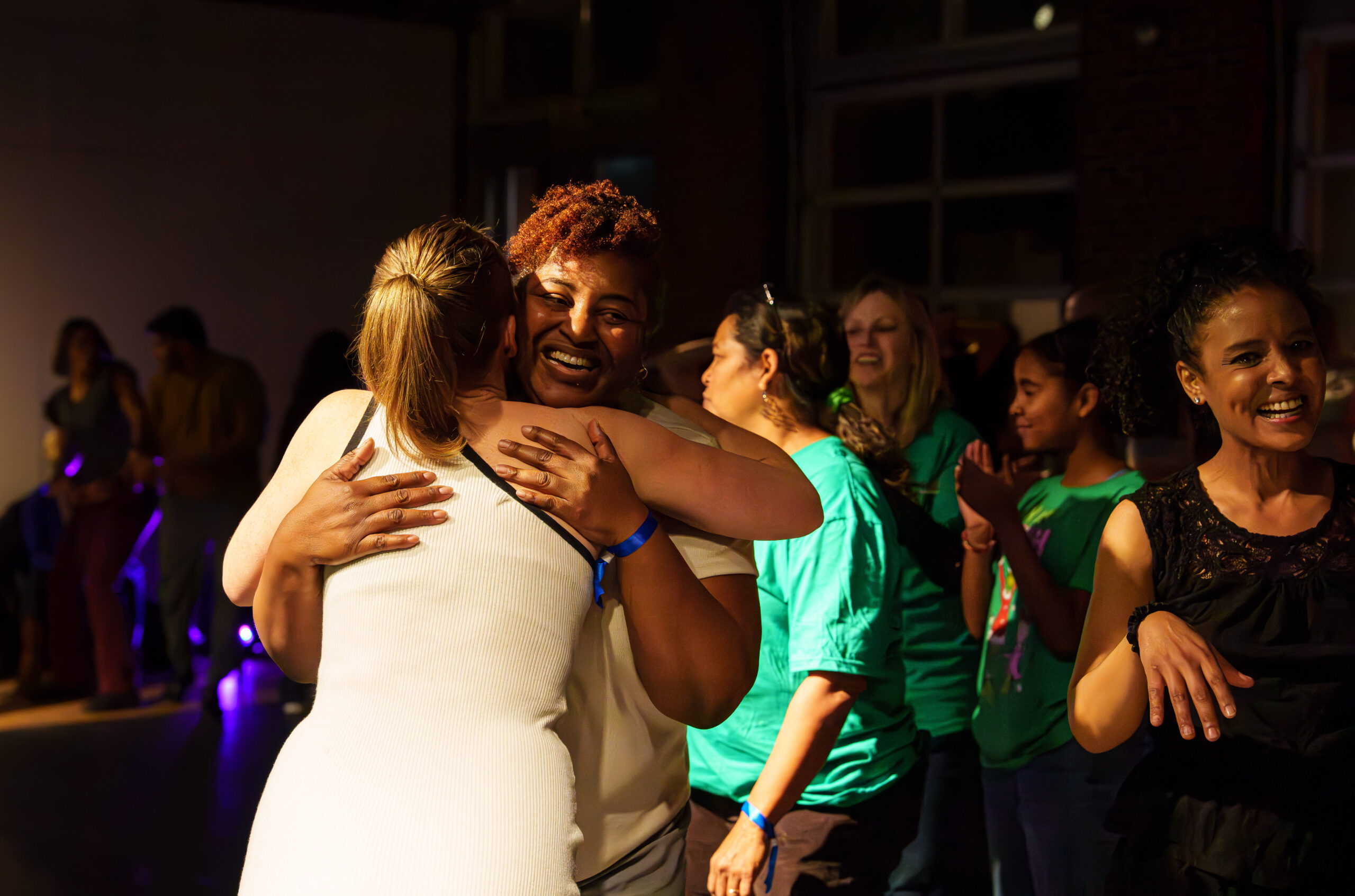 Friends connect at the December 2025 DC Casineros Cuban Dance Social.