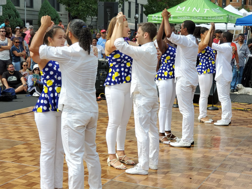 DC Casineros dancers performing Cuban partner dance for an outdoor audience