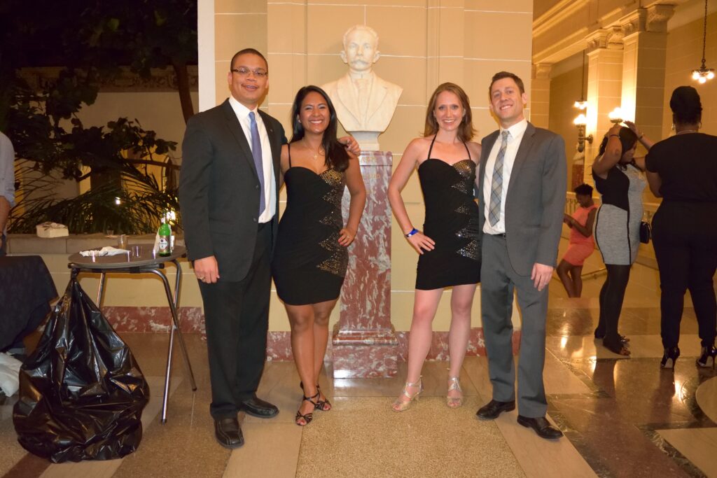 Four DC Casineros dancers in coordinated black costumes at the Organization of American States in 2015