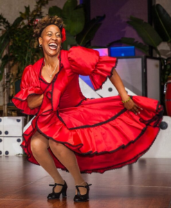 Marisol Blanco dancing in a red and black dress
