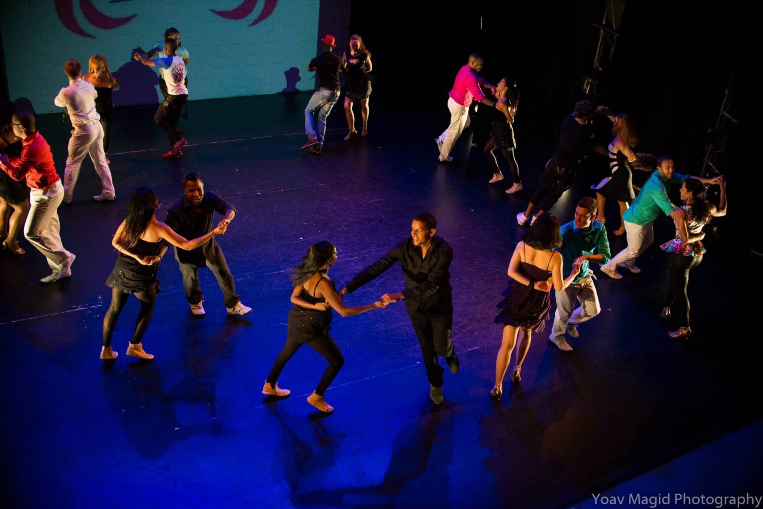 Dancers performing in pairs across the Dance Place stage during the DC Casineros and All Stars collaboration Somos Cubanos, March 6, 2015.